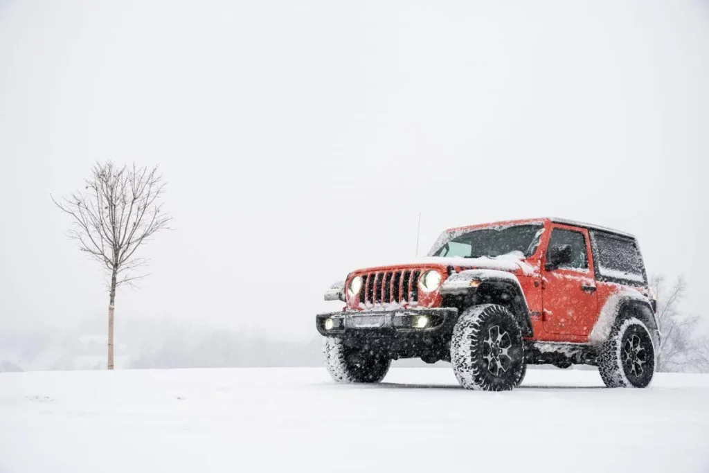 red Jeep in snow