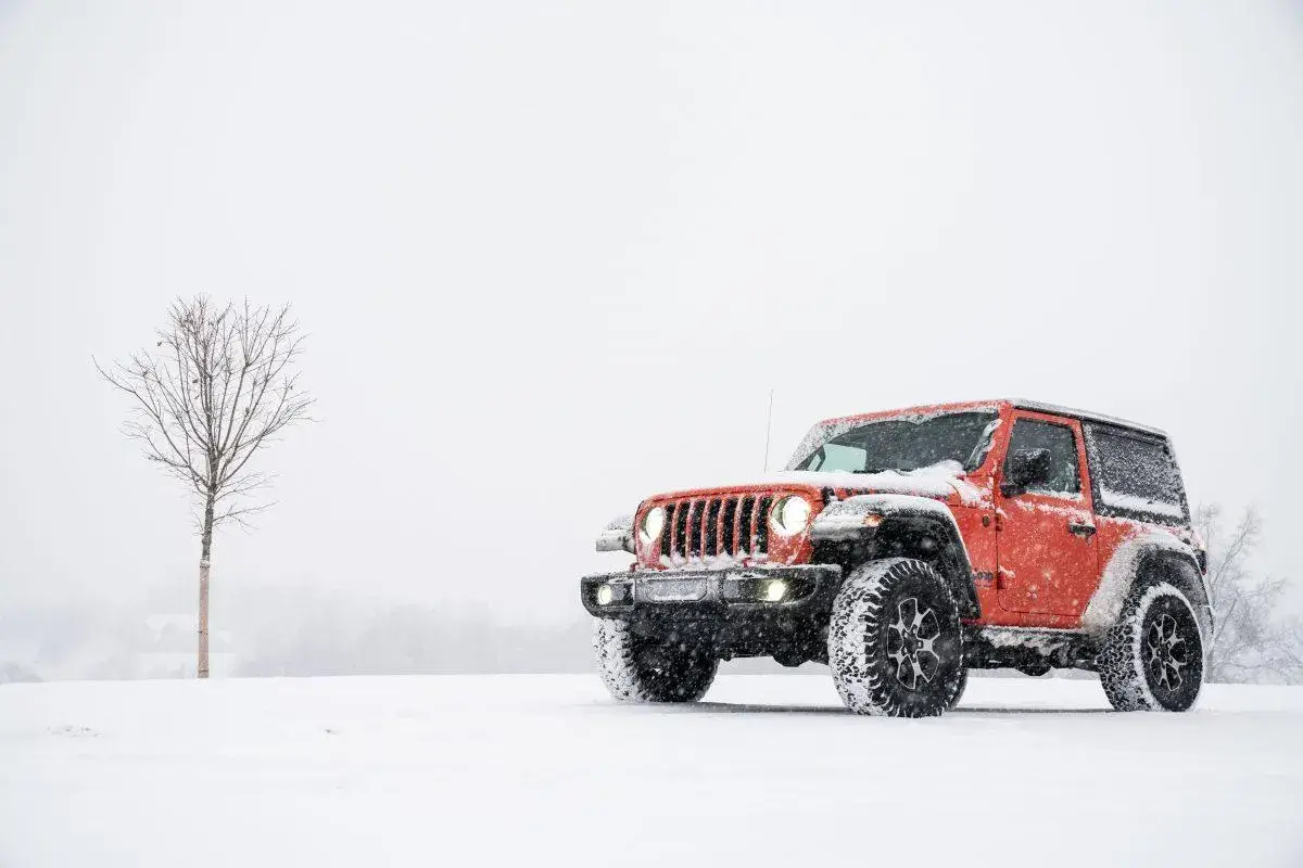 red Jeep in snow